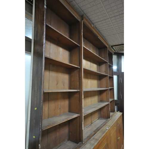 1302 - A LARGE 19TH CENTURY OAK BOOKCASE, the top breakfront section fitted with four astragal glazed doors... 