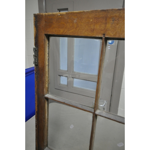 1302 - A LARGE 19TH CENTURY OAK BOOKCASE, the top breakfront section fitted with four astragal glazed doors... 