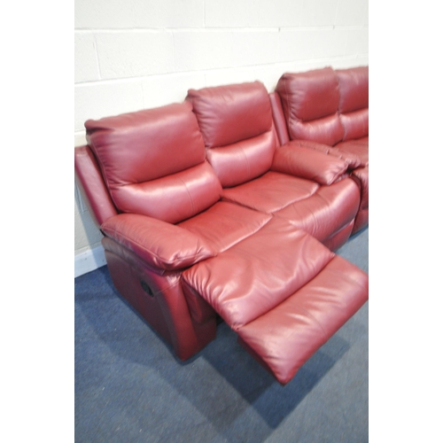 1310 - A RED LEATHER TWO PIECE RECLINING LOUNGE SUITE, comprising of two two seater settee, one electric an... 