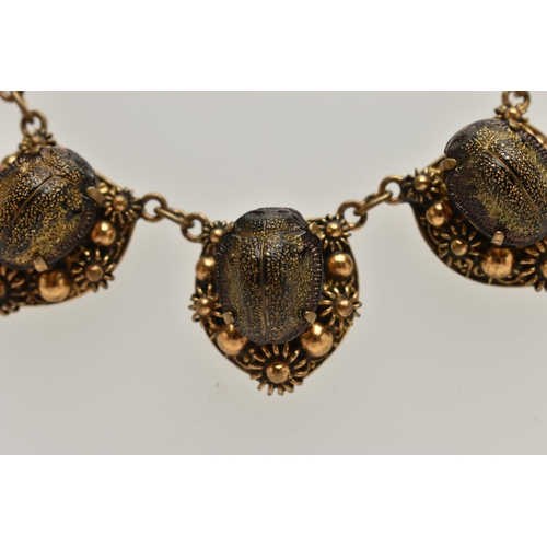 1 - A LATE 19TH CENTURY SCARAB NECKLACE, a gilt necklace comprised of seven floral panels, each prong se... 