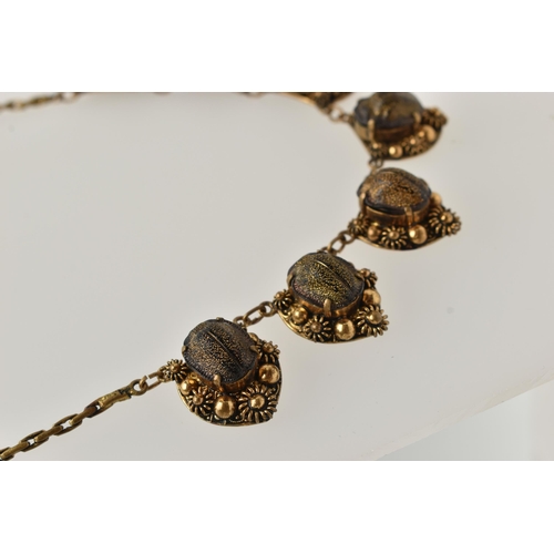 1 - A LATE 19TH CENTURY SCARAB NECKLACE, a gilt necklace comprised of seven floral panels, each prong se... 