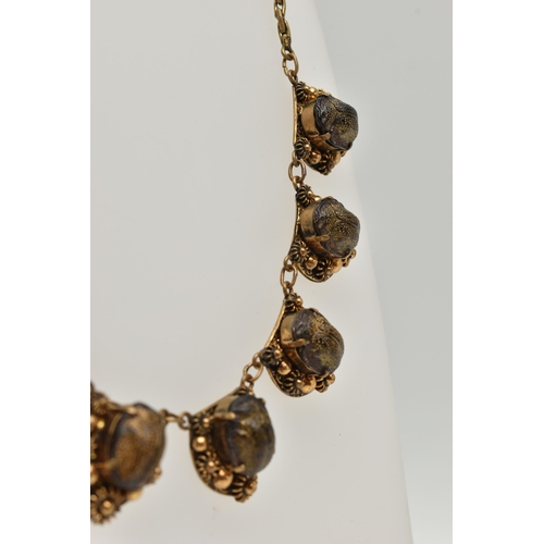 1 - A LATE 19TH CENTURY SCARAB NECKLACE, a gilt necklace comprised of seven floral panels, each prong se... 