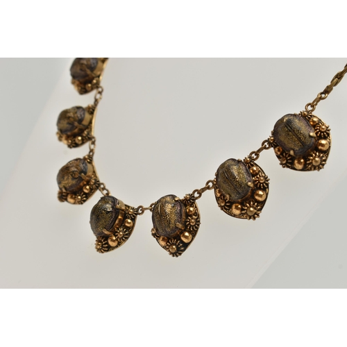 1 - A LATE 19TH CENTURY SCARAB NECKLACE, a gilt necklace comprised of seven floral panels, each prong se... 