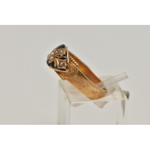 10 - AN EARLY 20TH CENTURY 15CT GOLD MOURNING RING, designed as a cross with foliage detail set with seed... 