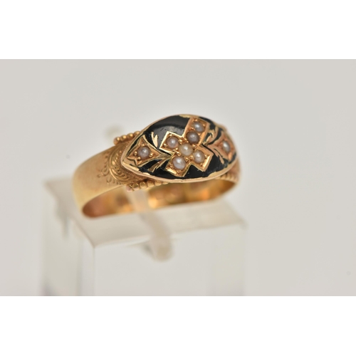 10 - AN EARLY 20TH CENTURY 15CT GOLD MOURNING RING, designed as a cross with foliage detail set with seed... 