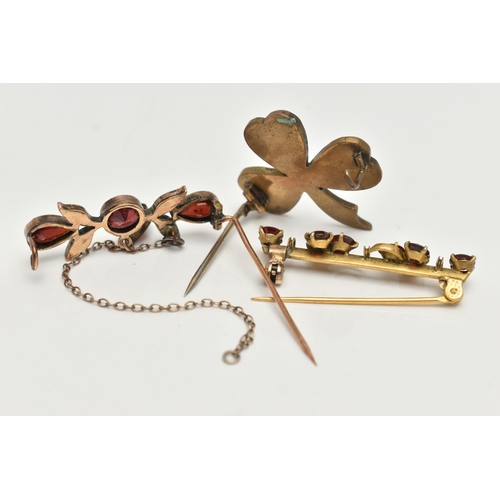 16 - THREE EARLY 20TH CENTURY GARNET BROOCHES, two bar brooches and a clover bohemian garnet brooch, (con... 