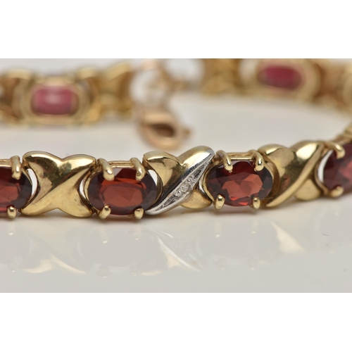 17 - A 9CT GOLD AND GARNET BRACELET, twelve oval cut garnets, prong set in yellow metal, interspaced betw... 