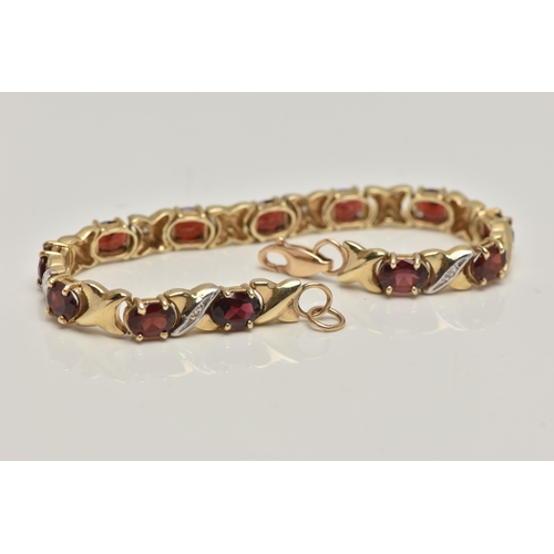 17 - A 9CT GOLD AND GARNET BRACELET, twelve oval cut garnets, prong set in yellow metal, interspaced betw... 