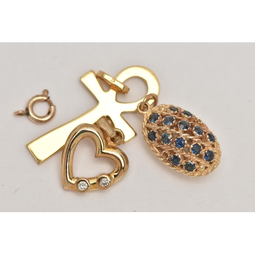 26 - THREE 9CT GOLD PENDANTS, the first a yellow gold open work heart pendant, bezel set with two round b... 