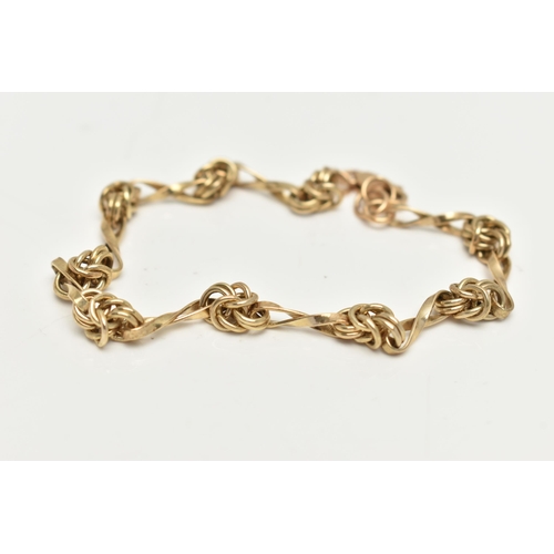 31 - A 9CT GOLD FANCY LINK BRACELET,  yellow gold knot link chain bracelet, fitted with a lobster clasp, ... 