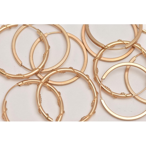 38 - AN ASSORTMENT OF SIX PAIRS OF YELLOW METAL HOOP EARRINGS, hollow hoops with sleep fittings, varying ... 