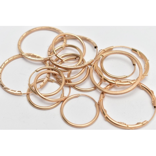 46 - AN ASSORTMENT OF EIGHT PAIRS OF YELLOW METAL HOOP EARRINGS, hollow hoops with sleeper fittings, vary... 