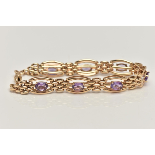 57 - A 9CT GOLD AMETHYST BRACELET, seven oval cut amethyst prong set in yellow gold, interspaced between ... 