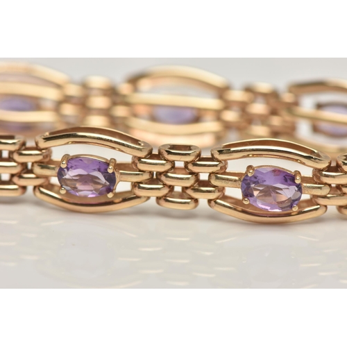 57 - A 9CT GOLD AMETHYST BRACELET, seven oval cut amethyst prong set in yellow gold, interspaced between ... 