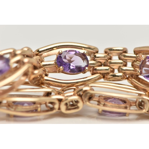 57 - A 9CT GOLD AMETHYST BRACELET, seven oval cut amethyst prong set in yellow gold, interspaced between ... 