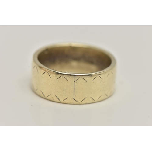 6 - A YELLOW METAL BAND RING, a wide band ring with etched detail, approximate width 7mm, stamped 9ct, r... 