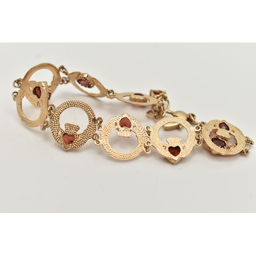 60 - A 9CT GOLD AND GARNET CLADDAGH BRACELET, nine circular claddagh links, each set with a heart cut gar... 