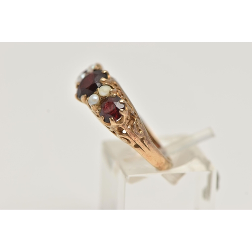 72 - A 9CT GOLD GARNET AND SPLIT PEARL RING, designed as three graduated circular garnets interspaced by ... 