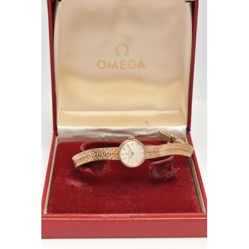 91 - A LADYS 9CT GOLD OMEGA WRISTWATCH, hand wound movement, round dial signed 'Omega', baton markers, ye... 