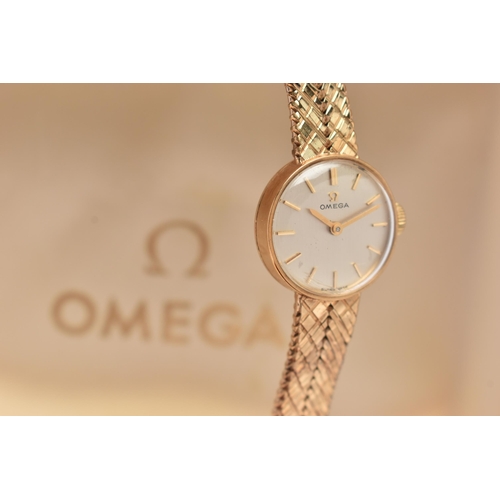 91 - A LADYS 9CT GOLD OMEGA WRISTWATCH, hand wound movement, round dial signed 'Omega', baton markers, ye... 