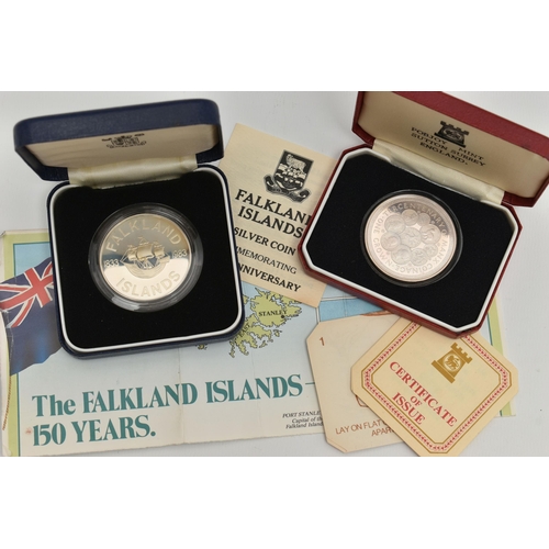 117 - TWO CASED SILVER COINS, the first a Falkland Island 150th anniversary coin, an Tercentenary Crown co... 