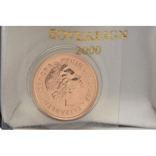 123 - A FULL SOVEREIGN COIN, 2000 George and the Dragon, Elizabeth II, encased in plastic casing