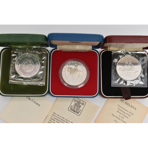 133 - THREE CASED COINS, to include a Proof commemorative coin of the Queens Silver Jubilee 1977 coin, a c... 