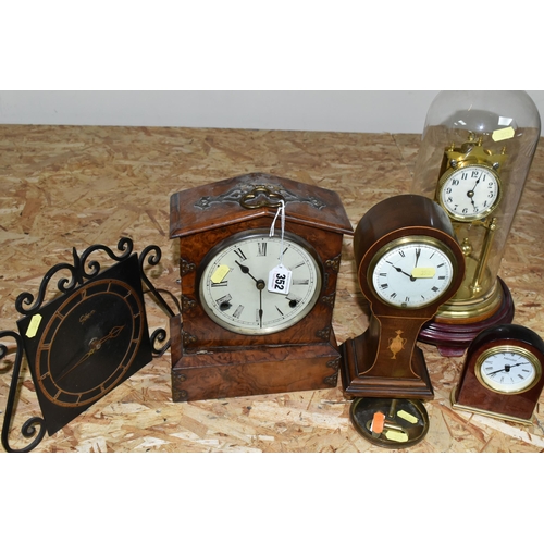 352 - A GROUP OF FIVE CLOCKS, comprising a German anniversary clock, marked 154124 with key (not on origin... 