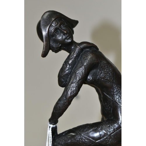 370 - AFTER DEMETRE CHIPARUS, A BRONZE 'HARLEQUIN' FIGURE, modelled glancing over her shoulder, standing o... 