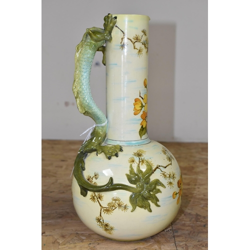 371 - A LATE NINETEENTH CENTURY DOULTON LAMBETH FAIENCE EWER, with green handle in the form of a dragon, t... 