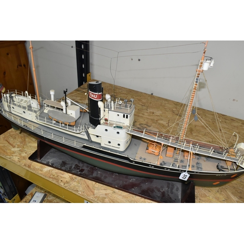 372 - A MOTORISED MODEL SHIP, RAU IX, rests on a stand, motor in internal compartment, length approximatel... 