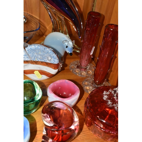 383 - A GROUP OF COLOURED STUDIO GLASS, comprising a pair of cranberry glass Thorn vases, a tall blue and ... 