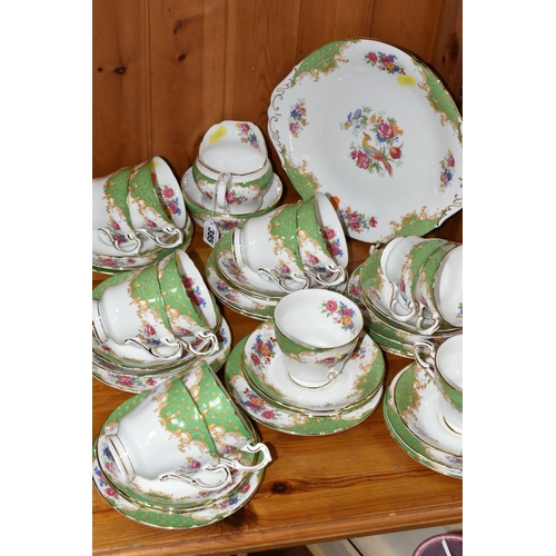 385 - A PARAGON 'ROCKINGHAM' PATTERN TEA SET, comprising a cake plate, milk jug, twelve cups, twelve sauce... 