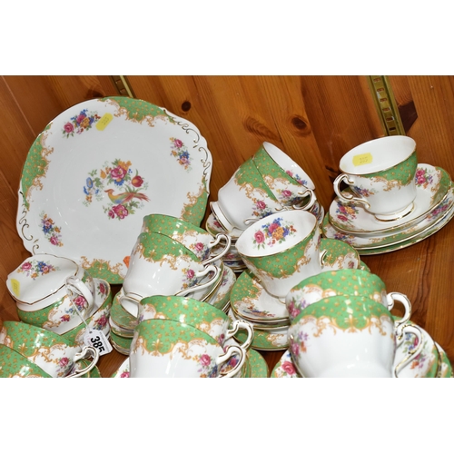 385 - A PARAGON 'ROCKINGHAM' PATTERN TEA SET, comprising a cake plate, milk jug, twelve cups, twelve sauce... 