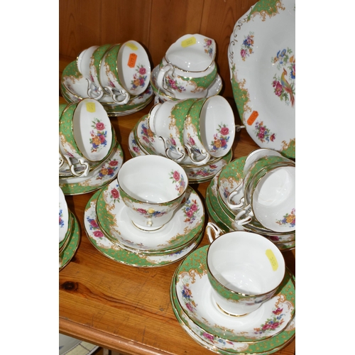 385 - A PARAGON 'ROCKINGHAM' PATTERN TEA SET, comprising a cake plate, milk jug, twelve cups, twelve sauce... 