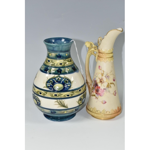 399 - A 1930s MOORCROFT POTTERY VASE AND A ROYAL WORCESTER BLUSH IVORY JUG, the Moorcroft baluster vase in... 