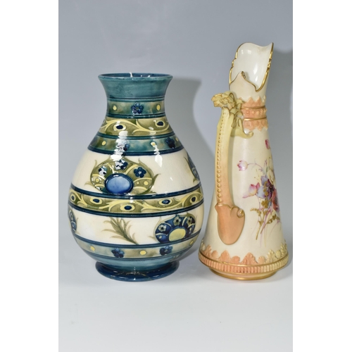 399 - A 1930s MOORCROFT POTTERY VASE AND A ROYAL WORCESTER BLUSH IVORY JUG, the Moorcroft baluster vase in... 