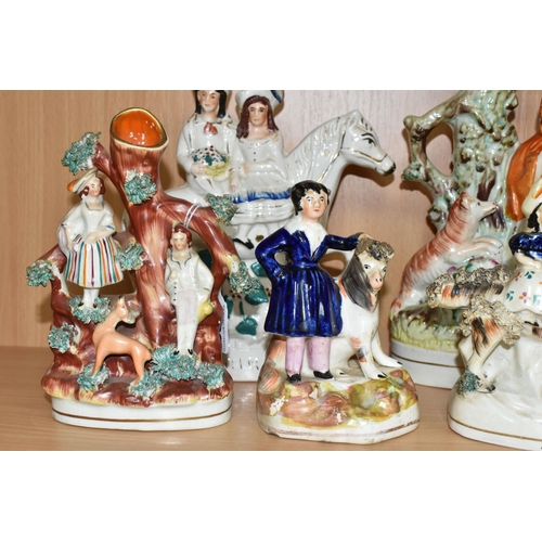 402 - SEVEN NINETEENTH CENTURY STAFFORDSHIRE FIGURES AND FIGURE GROUPS, comprising three flatback spill va... 