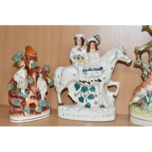 402 - SEVEN NINETEENTH CENTURY STAFFORDSHIRE FIGURES AND FIGURE GROUPS, comprising three flatback spill va... 