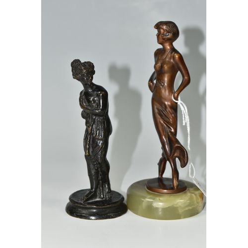 403 - TWO SMALL BRONZE FIGURINES, comprising a twentieth century figure of a woman, mounted to an onyx pli... 