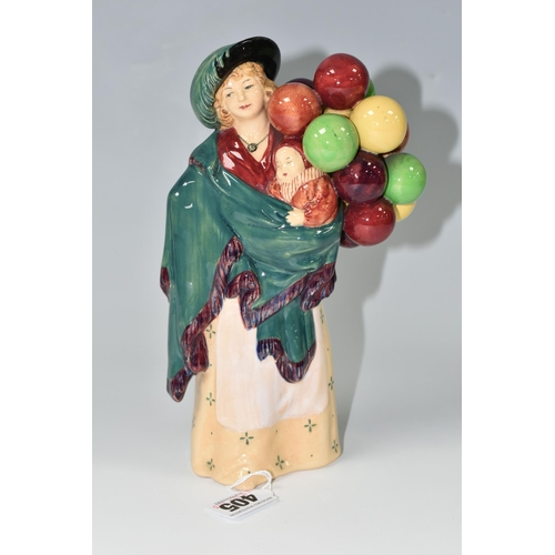 405 - A ROYAL DOULTON FIGURINE - 'THE BALLOON SELLER', model no HN583, issued 1923-1949, green printed bac... 