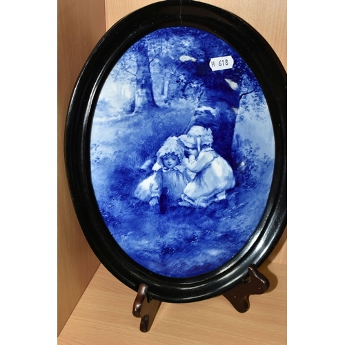 412 - A ROYAL DOULTON BLUE CHILDREN PLAQUE AND A MORRISIAN WARE JUG, the framed oval plaque decorated with... 