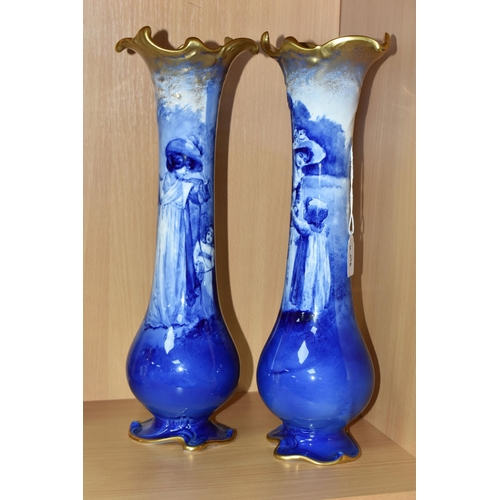 415 - A NEAR PAIR OF ROYAL DOULTON 'BLUE CHILDREN' VASES, of slender baluster form, with gilt scrolling mo... 