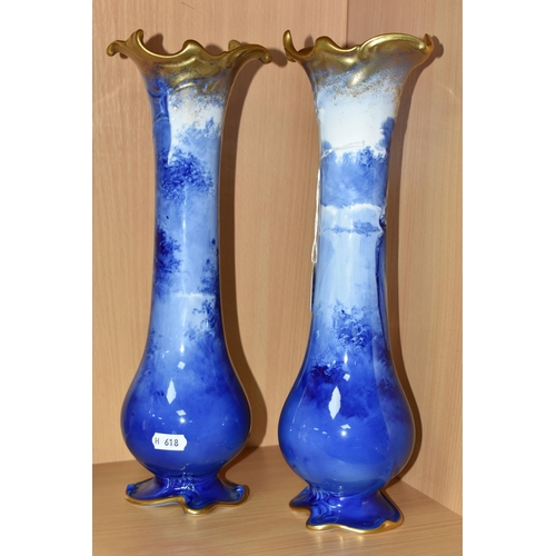 415 - A NEAR PAIR OF ROYAL DOULTON 'BLUE CHILDREN' VASES, of slender baluster form, with gilt scrolling mo... 