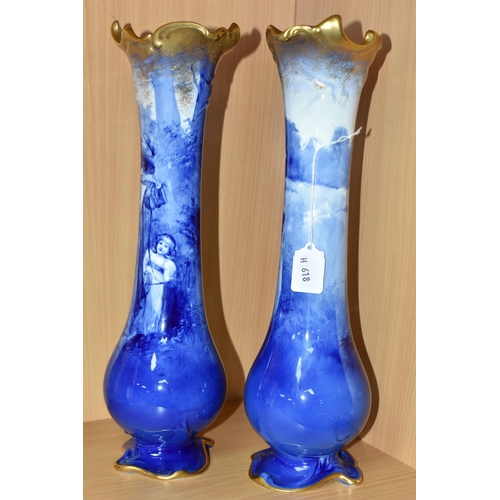 415 - A NEAR PAIR OF ROYAL DOULTON 'BLUE CHILDREN' VASES, of slender baluster form, with gilt scrolling mo... 