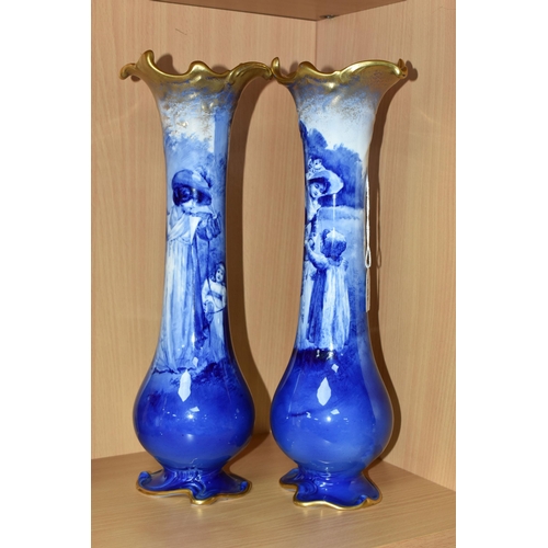 415 - A NEAR PAIR OF ROYAL DOULTON 'BLUE CHILDREN' VASES, of slender baluster form, with gilt scrolling mo... 