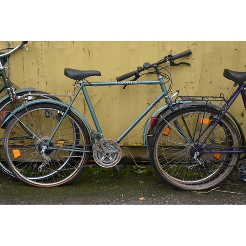 1002 - AN ALPINA YELLOW AND PURPLE BICYCLE, with a 22 inch frame, and two green vintage bicycles (condition... 