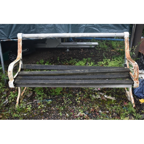 1005 - A DISTRESSED GARDEN BENCH, with wooden slats and cast iron ends, length 160cm (condition report: som... 