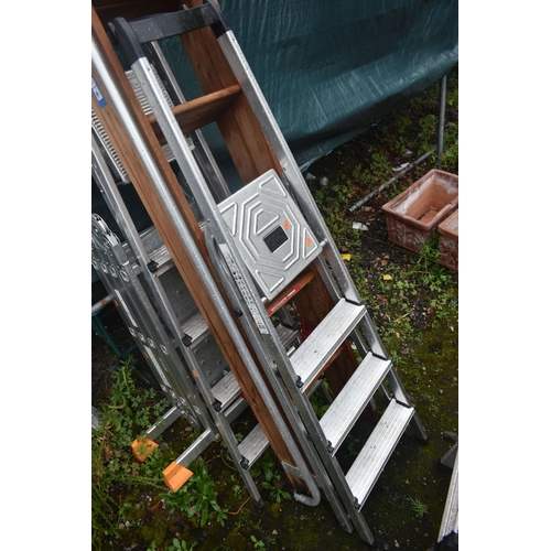 1010 - FIVE VARIOUS LADDERS, to include a workzone multi function ladder, two aluminium step ladders, a woo... 