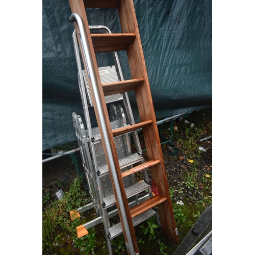 1010 - FIVE VARIOUS LADDERS, to include a workzone multi function ladder, two aluminium step ladders, a woo... 